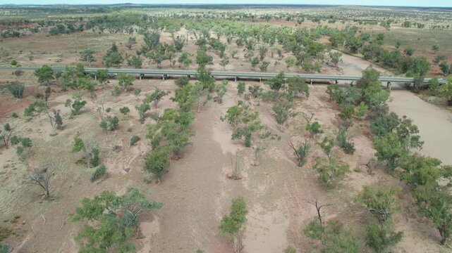 Aerial view of the Stuart Highway bridge over the dry Hugh River. Northern Territory, Australia. August 2022.