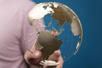 Person interacts with a digital globe, representing global connectivity and networking.