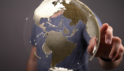 High-quality stock photo of a hand interacting with a digital 3D model of planet Earth,...