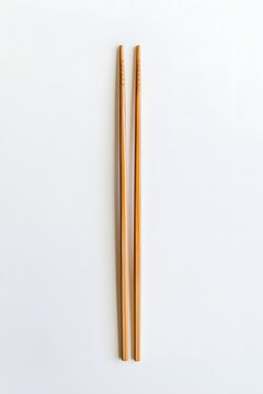 1 pair of chopsticks on a white background