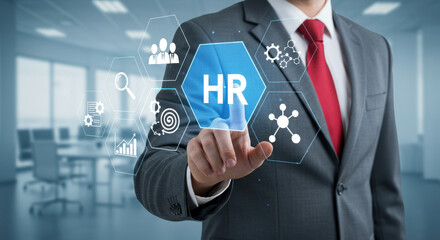 Virtual HR Solutions: Businessman in suit touching interactive hexagon, managing human resources with innovative digital tools.