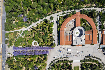 Aerial view of Zappeion Mansion in Athens, surrounded by symmetrical gardens and tree-lined paths,...