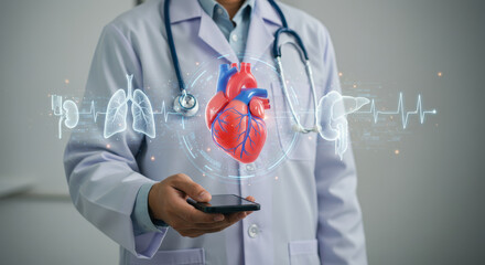 Virtual medicine: Doctor uses mobile to visualize heart health alongside lungs, kidneys, liver & EKG data in futuristic healthcare display.