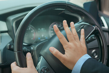The sudden sound of a car horn startled pedestrians and they turned to look.
