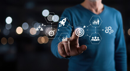 Virtual strategy: Mature man taps target in online network illustrating goals, teamwork, and business development.