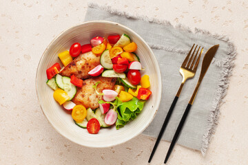 Chicken fillet grill with vegetable salad in a bowl on the table
