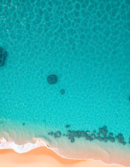 Bird's-eye perspective of shimmering turquoise waves along the sandy shoreline, pop art. with white shades