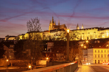 Illuminated St Vitus Cathedral at sunset in Prague Czech Republic