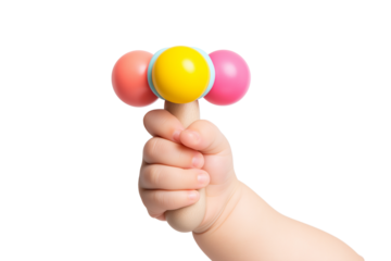 cute baby's hand holding colorful rattle isolated on white background