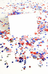 Folded paper blank sheet card mockup ,4th of July USA Independence Day decorations stars and flags confetti pattern isolated  on white background.  copy space