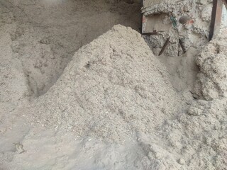 Sugarcane bagasse, a sugar mill byproduct, reused as eco-friendly fuel—sustainable energy from agricultural waste.