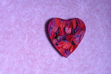 red heart on paper background