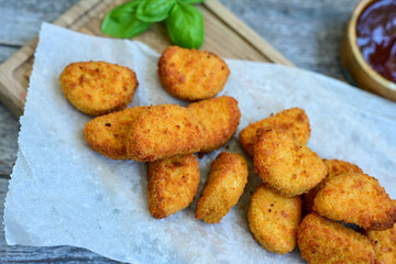 
 Crispy oven baked  chicken nuggets and  barbeque sauce . Breaded chicken fillets  with chilly...