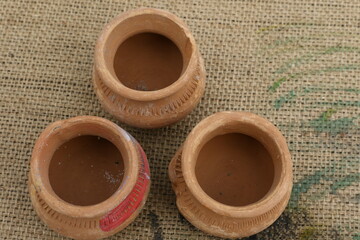 clay pots on wooden background