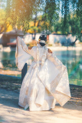 Asian woman wearing hanbok, a traditional Korean costume, at Gyeongbokgung Palace Landmarks in Seoul, South Korea