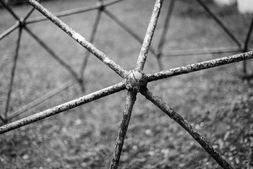 Part of an old metal structure in the shape of a molecule from a children's playground from the USSR.