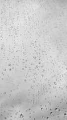 Raindrops sliding on glass during a rainy day in prague copy space