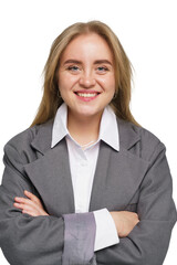 Confident young woman in a gray blazer smiles warmly with crossed arms in a professional setting