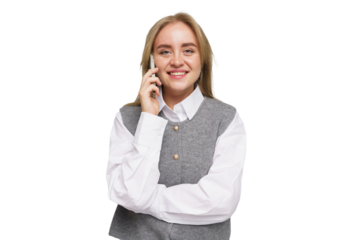 Young woman cheerfully conversing on the phone while dressed in a stylish outfit in a well-lit studio space