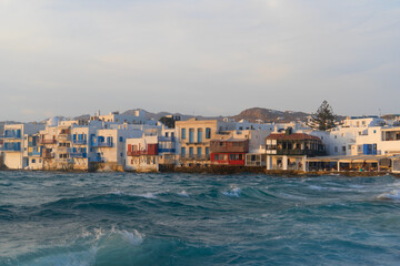 sea and seaside cafe table at Mykonos island, Greece at summer