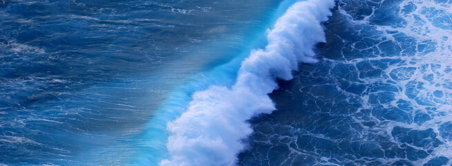 Banner Turquoise ocean sea water white wave pattern splashing deep blue sea. Banner Tropical sea beach Seascape dark background wave splash on rock. Summer Ocean Surface big wave with copy space © aFotostock