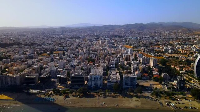 Evening sunset over Limassol, Cyprus. Aerial view of modern urban architecture and glass skyscrapers of Cyprus. Mediterranean Sea near Limassol, Cyprus. High quality footage 4k