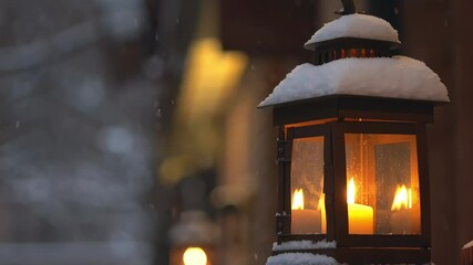 A rustic metal lantern with warm candlelight flickering inside - Powered by Adobe