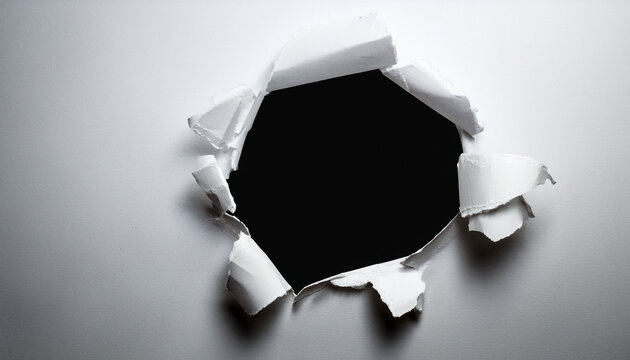 hole in the paper with torn sides