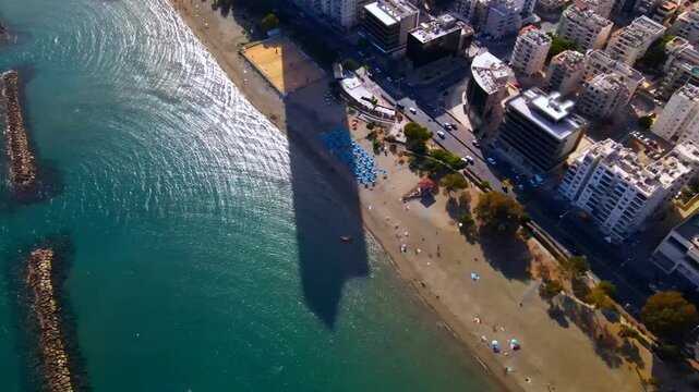 Evening sunset over Limassol, Cyprus. Aerial view of modern urban architecture and glass skyscrapers of Cyprus. Mediterranean Sea near Limassol, Cyprus. High quality footage 4k
