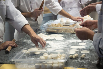 Chefs Cooking And Rolling In Kitchen To Make Dim sum