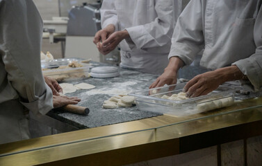 Group Of Chefs Preparing Ingredient For Fresh Made Duimsum