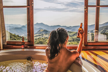Woman on Jacuzzi drinking a beer