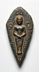 Dark, sculpted amulet of a standing figure, shaped like a pointed diamond