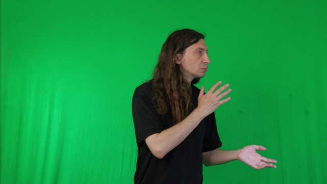 A man is shown in a martial arts stance, seemingly practicing a Kung Fu move against a vibrant green screen background. His body is positioned for action, conveying discipline and training