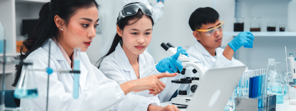 Diverse team of scientists collaborating in a research lab, combining technology, precision, and innovation to represent inclusivity, progress, and professionalism in modern scientific organizations.