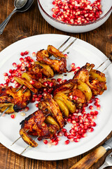 Delicious fried BBQ chicken wings on plate.