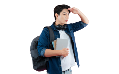 Portrait of Asian male student wearing headphones , holding book and posing on PNG background	
