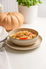 Healthy quinoa bowl with vegetables and pumpkin.