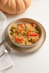 Healthy quinoa bowl with vegetables and pumpkin.