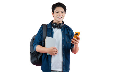 Portrait of Asian male student wearing headphones and backpack , holding phone and pointing finger...