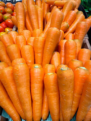 Fresh organic Carrots in basket for selling in the supermarket.