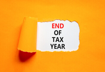 End of tax year symbol. Concept words phrase End of tax year on beautiful white paper. Beautiful...