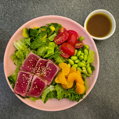 A colorful salmon salad plate.
