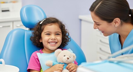 Young girl smiling while sitting in dentist chair with teddy bear  