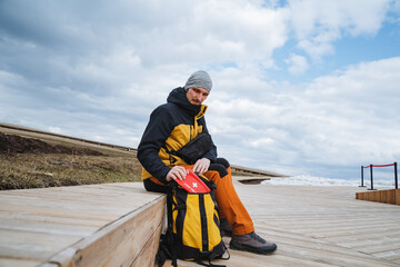 An adventurous hiker in an exciting exploration setting, surrounded by breathtaking landscapes and...