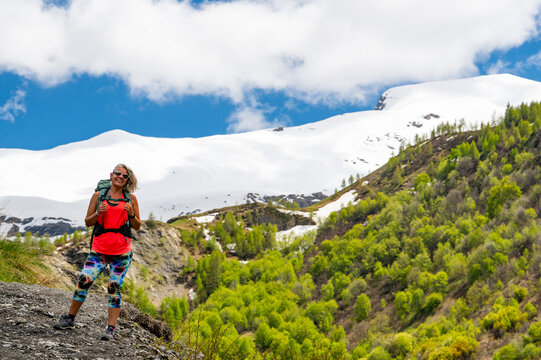 Female Hiker Hiking the Park des Ecrins mountains in south France during Springtime