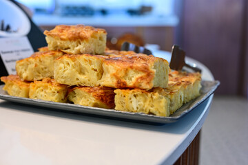 Bakery .Home made  cheese pie  with phyllo pastry, feta cheese  and organic eggs. Bulgarian banitsa. Brekfast on a display at Hotel
