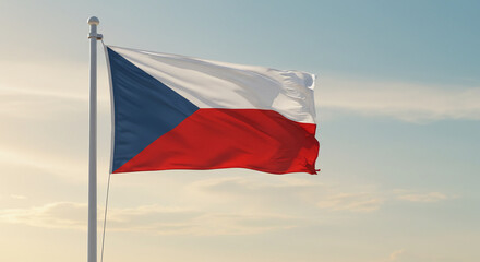 The Czech Republic’s national flag waving clearly in the early morning light with a pale blue sky in the background.