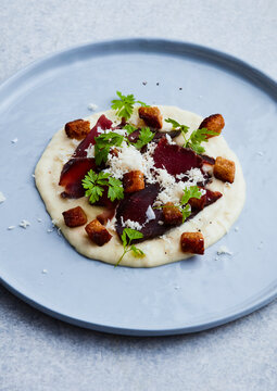 meat with croutons and puree