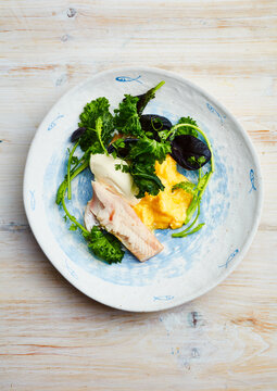 fish with greens and sauce